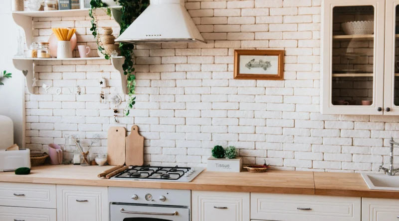 Chopping Boards Near Oven Under a Kitchen Chimney Hood inside a house