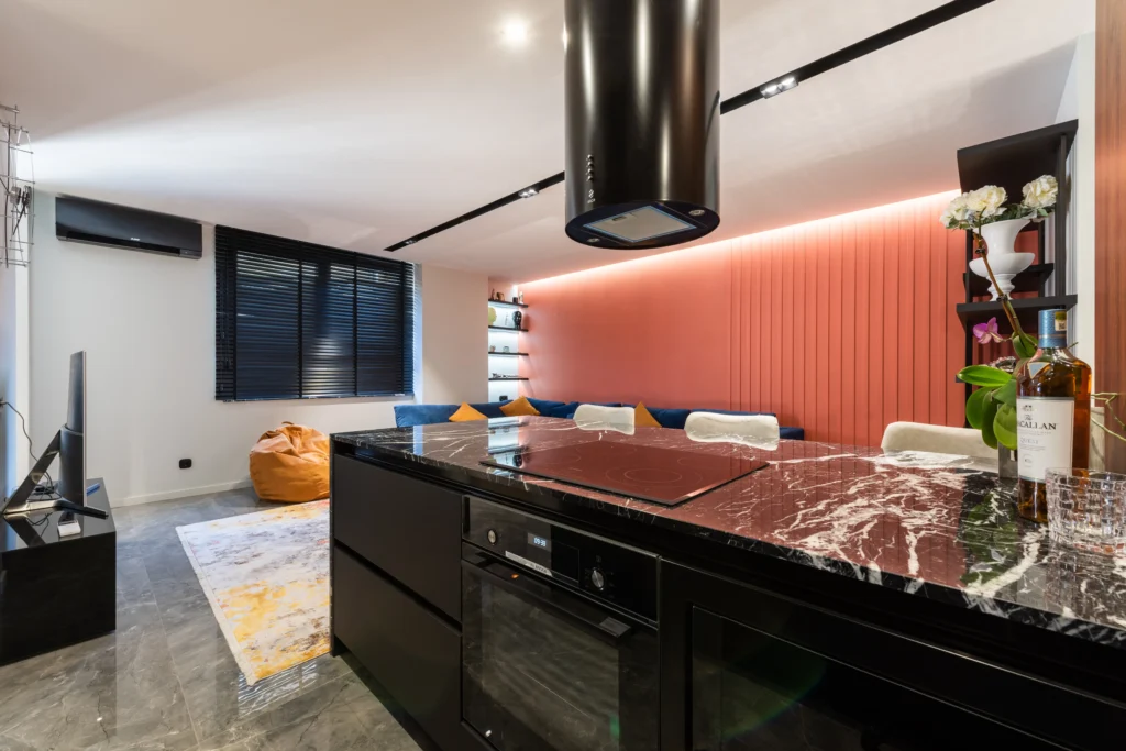 Modern kitchen interior with hob under an Island Chimney Hood at home